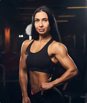 Female Bodybuilder Showing Her Strength By Flexing