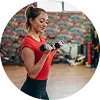Woman Lifting Dumbbells In The Gym